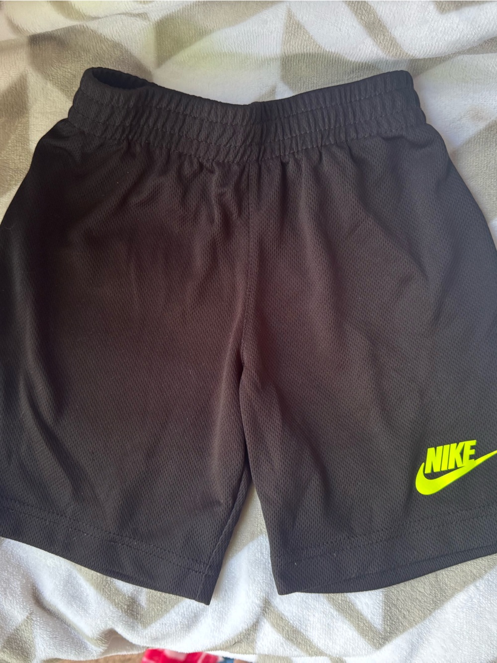 Nike black Athletic Shorts with yellow Logo